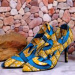 Vibrant Handmade Ankara heels with blue, yellow, and black African-inspired patterns, pointed toe and elegant silhouette.