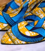 Vibrant Handmade Ankara heels with blue, yellow, and black African-inspired patterns, pointed toe and elegant silhouette.