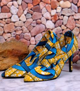 Vibrant Handmade Ankara heels with blue, yellow, and black African-inspired patterns, pointed toe and elegant silhouette.