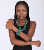 Two-layer malachite beaded necklace with four matching bracelets, showcasing deep green tones and natural banding.