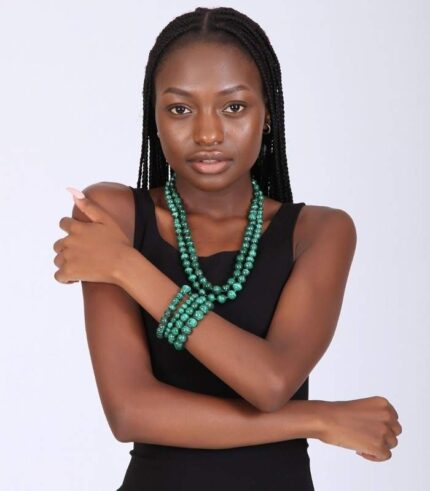 Two-layer malachite beaded necklace with four matching bracelets, showcasing deep green tones and natural banding.