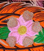 Desert Mirage Clutch featuring bold orange feather design and hand-beaded floral appliqué with sequins, inspired by the Vaal region.