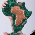 Large Malachite Africa Map shaped like the African continent with copper inlays marking borders and names, symbolizing heritage and strength.