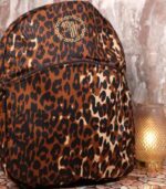 Leopard Luxe Backpack with golden brown and black leopard print, sleek silhouette, front pocket, and L’Africaine Boutique emblem.