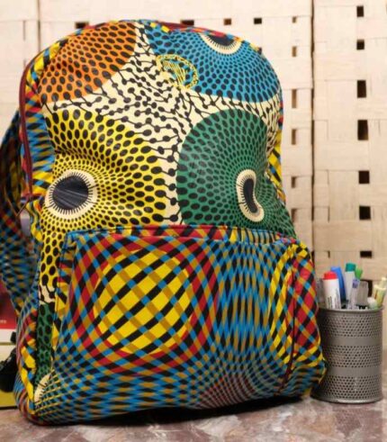Orbit Ankara Backpack with bold circular motifs in yellow, green, red, and blue, featuring structured design and L’Africaine Boutique logo.