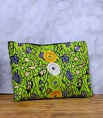 The Aura African Clutch in green Ankara fabric with floral and leafy print, featuring yellow, lime, and white embroidered sequin rings.