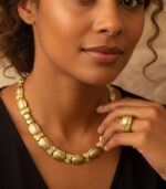 Timeless Golden Grace gold-plated necklace and bracelet set with fluid links and crystal accents, crafted by L’Africaine Boutique.