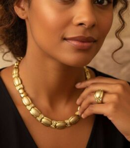 Timeless Golden Grace gold-plated necklace and bracelet set with fluid links and crystal accents, crafted by L’Africaine Boutique.