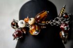 Animal Print bracelet with amber, cream, and brown glass beads featuring spotted and swirling patterns from L’Africaine Boutique.