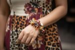 Animal Print bracelet with amber, cream, and brown glass beads featuring spotted and swirling patterns from L’Africaine Boutique.