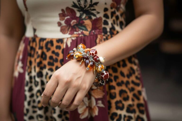 Animal Print bracelet with amber, cream, and brown glass beads featuring spotted and swirling patterns from L’Africaine Boutique.