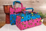 ankara star print purse by L’Africaine Boutique—crafted from wax fabric with bold star patterns, padded handles, and secure zipper closure.