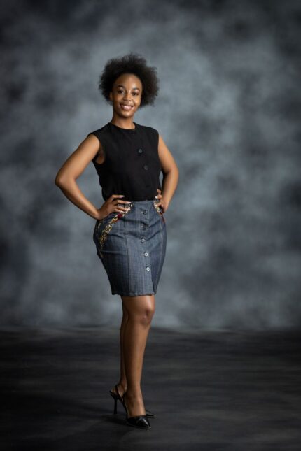 Contrast Denim Skirt in medium-wash denim with yellow-and-blue Ankara inserts and button-down front from L’Africaine Boutique.