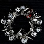 Dalmatians bracelet with black and white glass beads featuring marbled swirls and spotted motifs from L’Africaine Boutique.