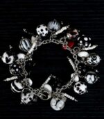 Dalmatians bracelet with black and white glass beads featuring marbled swirls and spotted motifs from L’Africaine Boutique.