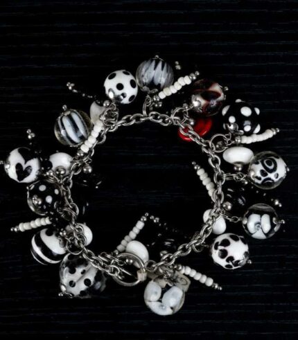 Dalmatians bracelet with black and white glass beads featuring marbled swirls and spotted motifs from L’Africaine Boutique.