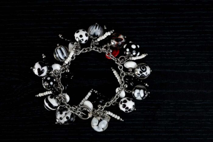 Dalmatians bracelet with black and white glass beads featuring marbled swirls and spotted motifs from L’Africaine Boutique.