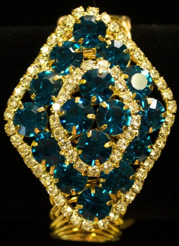 Diamond Crystal Bracelet Trio bracelet with emerald, teal-blue, and ruby-red crystals bordered by clear stones from L’Africaine Boutique.