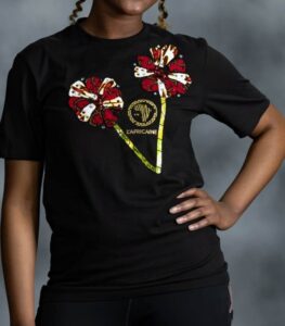 Double Bloom Tee with twin Ankara floral appliqués and gold emblem from L’Africaine Boutique.