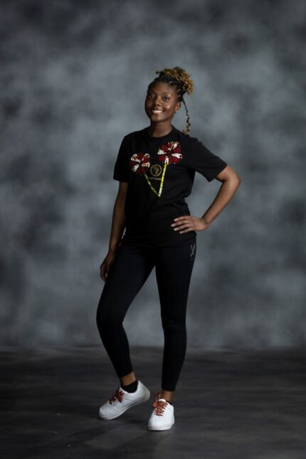 Double Bloom Tee with twin Ankara floral appliqués and gold emblem from L’Africaine Boutique.