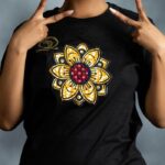 Floral Burst Tee with mandala-style flower appliqué in yellow, white, and red, accented by rhinestones on black cotton from L’Africaine Boutique.