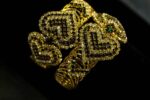 Gold-Plated Heart Bangles with woven heart-shaped patterns and rows of sparkling stones from L’Africaine Boutique.