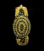 Gold-Plated Oval Bangles with concentric crystal patterns in black, aqua, and ruby tones from L’Africaine Boutique.