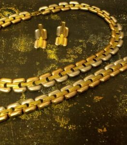 Golden Regal Bridal Set with wide gold-plated necklace, matching bracelet, and earrings featuring intricate patterns from L’Africaine Boutique.