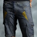 Golden Edge Jorts in deep blue denim with golden triangular patches, designed by L’Africaine Boutique.