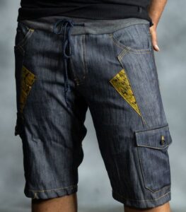 Golden Edge Jorts in deep blue denim with golden triangular patches, designed by L’Africaine Boutique.
