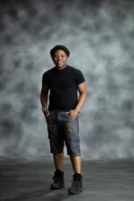 Golden Edge Jorts in deep blue denim with golden triangular patches, designed by L’Africaine Boutique.