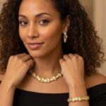 Golden Oval Link Bracelet and Earrings Set with polished gold-plated links and clear crystal inlays from L’Africaine Boutique.
