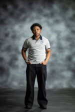 Grey Classic Polo shirt with navy collar and sleeve trim, featuring embroidered L’Africaine Boutique logo on the chest.