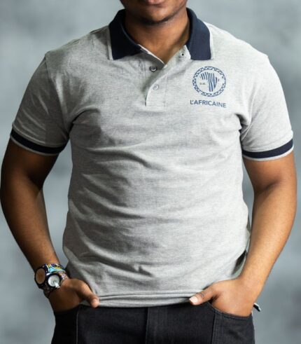 Grey Classic Polo shirt with navy collar and sleeve trim, featuring embroidered L’Africaine Boutique logo on the chest.