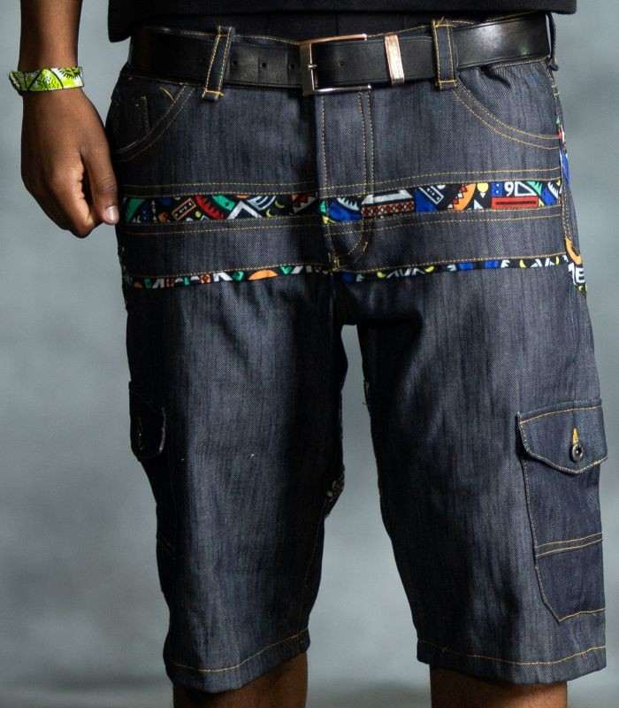 Heritage Stripe Jorts in dark-wash denim with patterned horizontal stripes across the upper panels from L’Africaine Boutique.