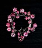 Rose Syrup bracelet with blush, fuchsia, and deep rose glass beads featuring floral-like swirls from L’Africaine Boutique.
