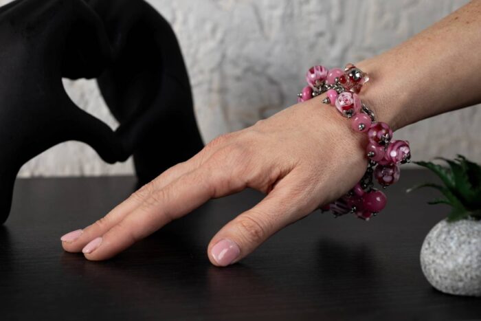 Rose Syrup bracelet with blush, fuchsia, and deep rose glass beads featuring floral-like swirls from L’Africaine Boutique.