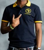 Midnight Gold Polo shirt in deep navy with golden-yellow collar and sleeve tips, featuring embroidered L’Africaine Boutique logo.