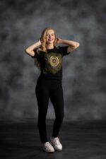 Radiance Burst Tee with circular African print in green and gold, symbolizing light and resilience—L’Africaine Boutique.