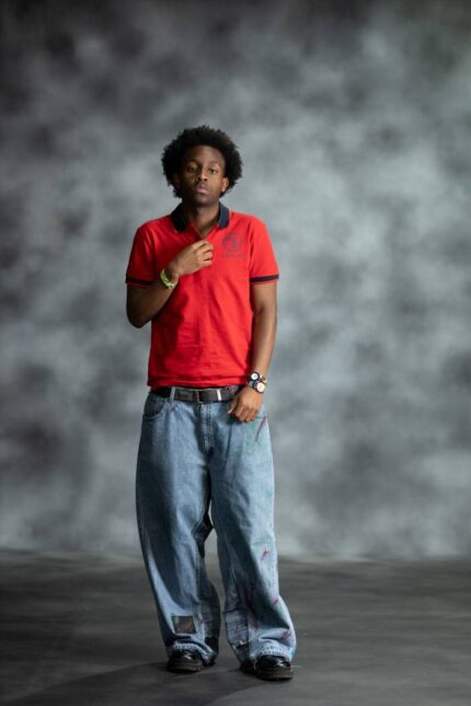 Red Power Polo shirt with navy collar and sleeve accents, featuring embroidered L’Africaine Boutique logo on the chest.
