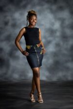 Side Accent Skirt in grey-blue denim with asymmetric button closure and muted cream, red, and brown Ankara accents from L’Africaine Boutique.