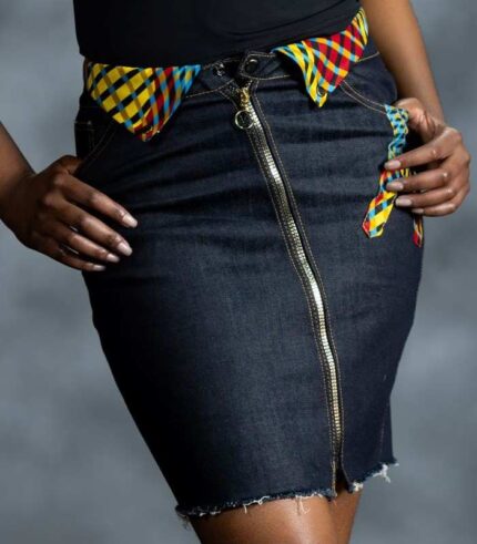 Side Accent Skirt in grey-blue denim with asymmetric button closure and muted cream, red, and brown Ankara accents from L’Africaine Boutique.