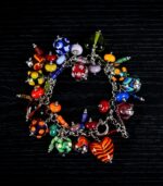 Summer Joy bracelet with glass beads in fiery reds, sunny yellows, ocean blues, and lush greens from L’Africaine Boutique.