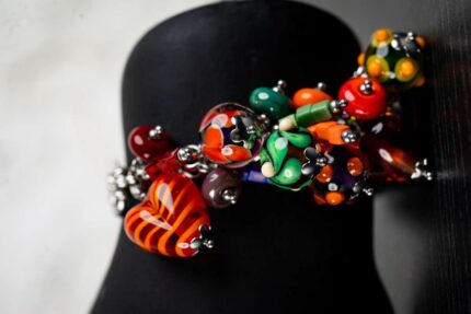 Summer Joy bracelet with glass beads in fiery reds, sunny yellows, ocean blues, and lush greens from L’Africaine Boutique.
