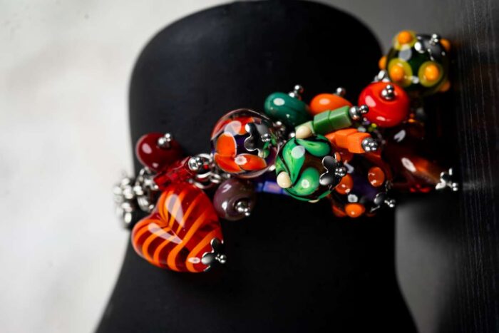 Summer Joy bracelet with glass beads in fiery reds, sunny yellows, ocean blues, and lush greens from L’Africaine Boutique.