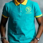 Teal Energy Polo shirt with golden-yellow collar and sleeve accents, featuring embroidered L’Africaine Boutique logo on the chest.