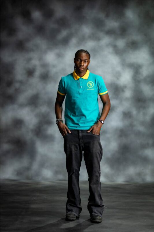 Teal Energy Polo shirt with golden-yellow collar and sleeve accents, featuring embroidered L’Africaine Boutique logo on the chest.