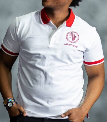 White Fire Polo shirt with red collar and sleeve accents, featuring embroidered L’Africaine Boutique logo on the chest.