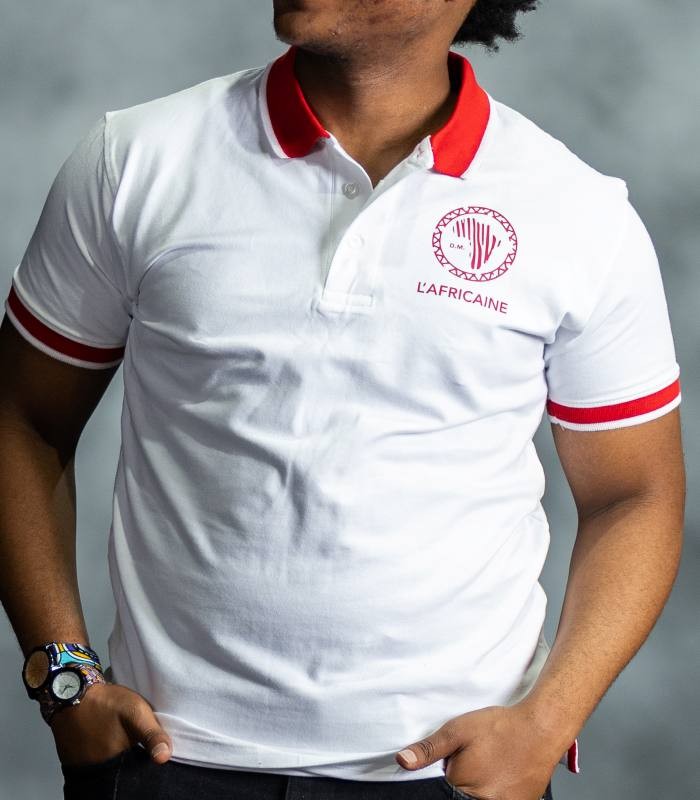 White Fire Polo shirt with red collar and sleeve accents, featuring embroidered L’Africaine Boutique logo on the chest.