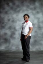 White Fire Polo shirt with red collar and sleeve accents, featuring embroidered L’Africaine Boutique logo on the chest.